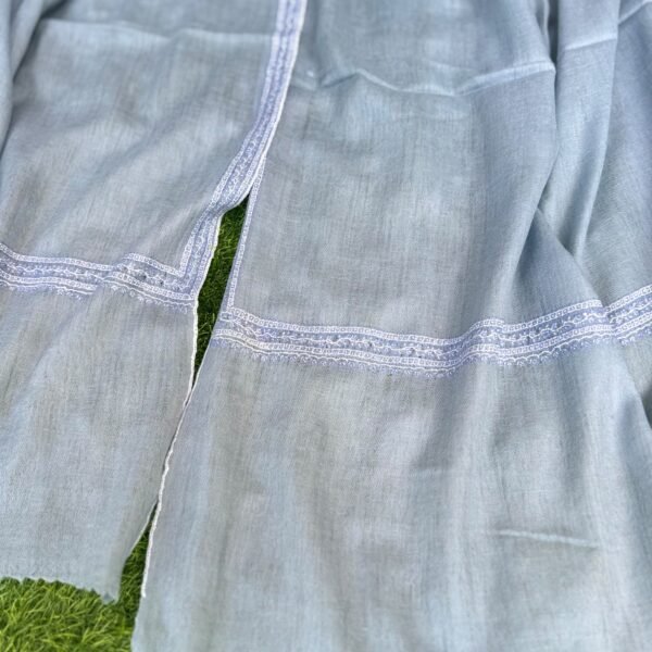 WhatsApp Image 2026-09-10 at 6.08.30 AM Hashidar Sozni Pashmina Stole — Powder Blue-Grey Shawl with White/Silver Embroidered Border.